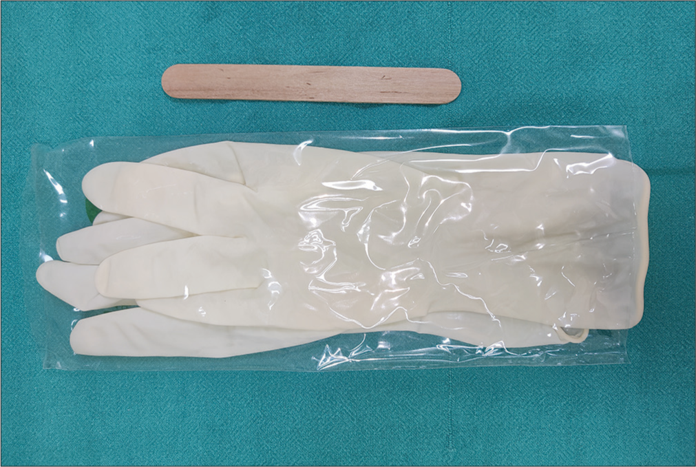 Use of Wooden Spatula for Palpation of Mucosal Lesions as an Alternative Tool to Gloved Finger